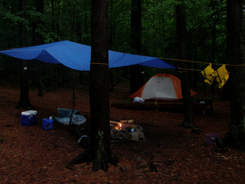 Somehow, their campsite looks serene, despite the pelting rains.