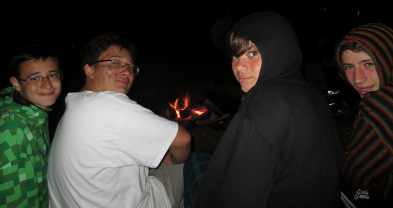 who -- believe it or not -- walk quietly up the hill while the older boys get to linger about the dying embers of the campfire.  To me, this always is a touching moment and very good camp!